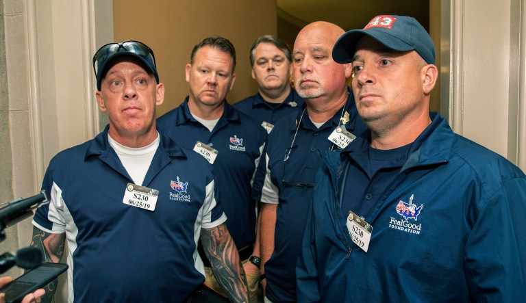 Sept. 11 first responders John Feal, left, Ret. Lt. Michael O'Connell, right, and other first responders speak to reporters as they leave the office of Senate Majority Leader Mitch McConnell, following their meeting at McConnell's office on Capitol Hill in Washington.