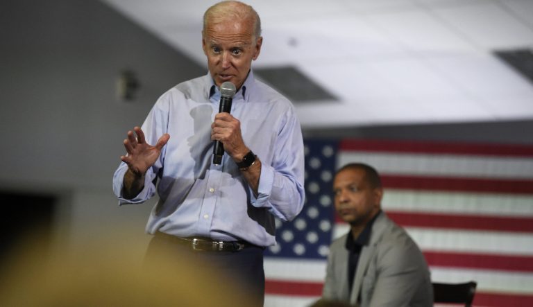 Democratic presidential candidate and former Vice President Joe Biden speaks at a town hall on Sunday, July 7, 2019, in Charleston, S.C., as state Sen. Marlon Kimpson looks on. 