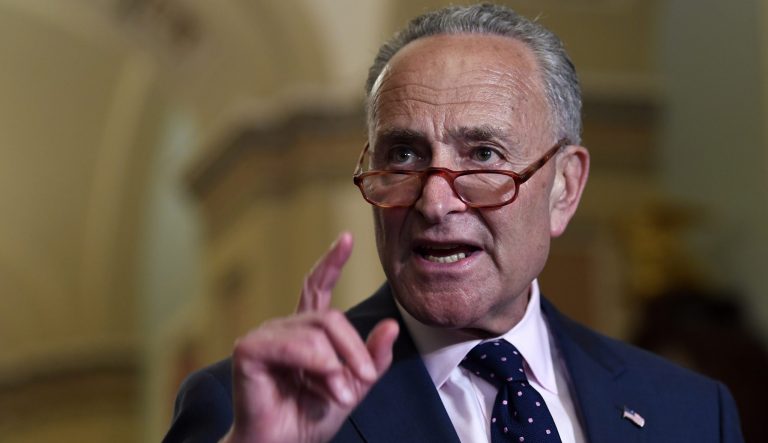 Senate Minority Leader Sen. Chuck Schumer of N.Y., center, speaks to reporters following the weekly policy luncheon on Capitol Hill in Washington, Tuesday, July 9, 2019. 