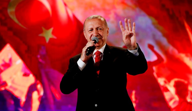 Turkey's President Recep Tayyip ErdoÄan gestures as he delivers a speech at a rally.