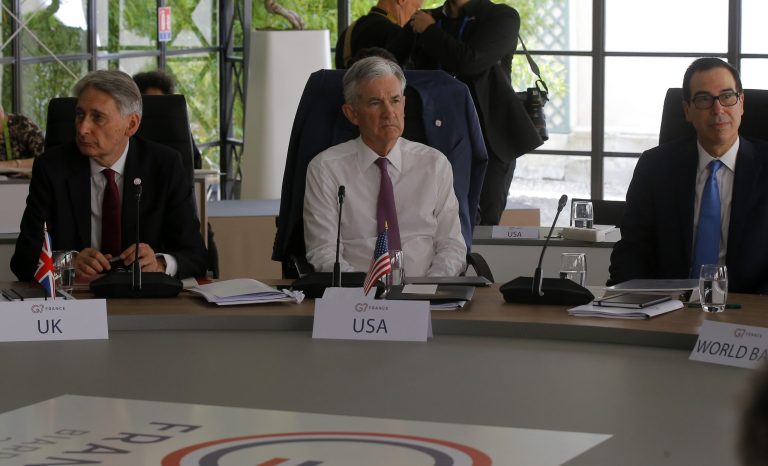 British Chancellor of the Exchequer Philip Hammond, left, Federal Reserve Chairman Jerome Powell, center, and U.S Treasury Secretary Steve Mnuchin attend a working session at the G-7 Finance Wednesday July 17, 2019 in Chantilly, north of Paris. 
