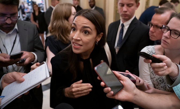 Rep. Alexandria Ocasio-Cortez, D-N.Y., responds to reporters at the Capitol in Washington, Thursday, July 18, 2019. 