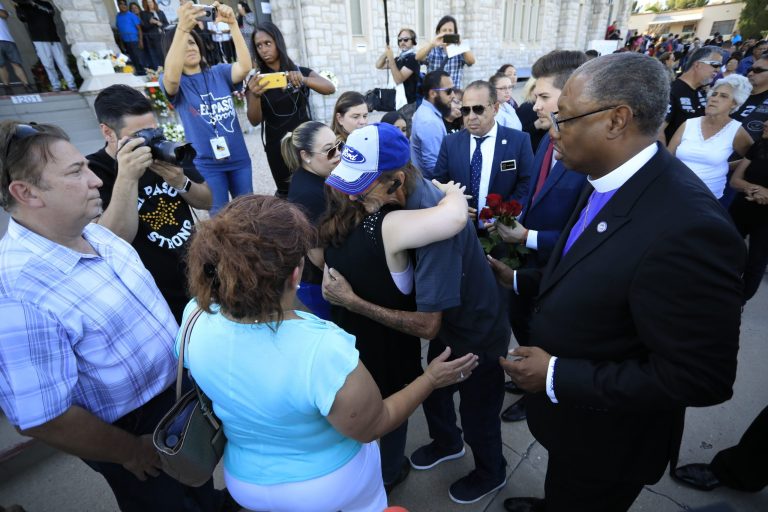 Antonio Basco, center right, companion of Margie Reckard, is greeted at La Paz Faith Memorial & Spiritual Center.