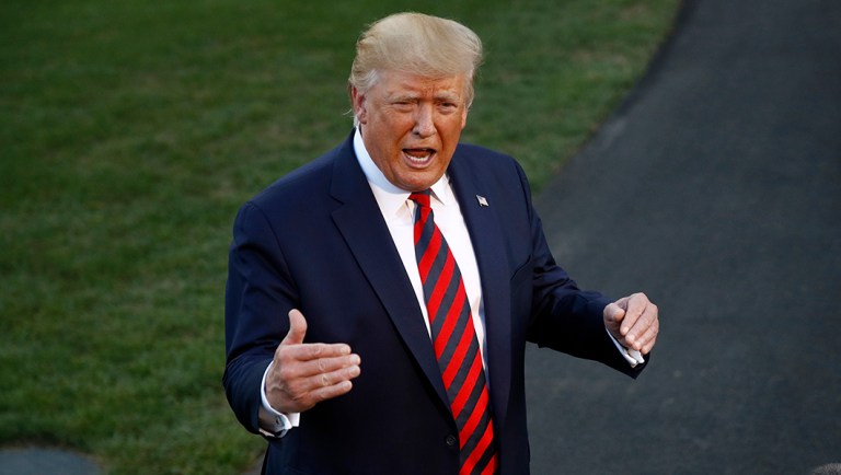 President Trump speaks with reporters.