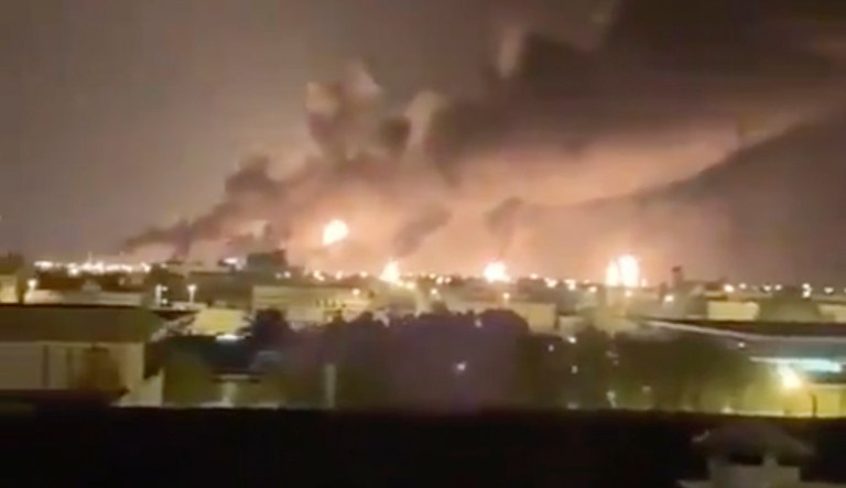 Smoke fills the sky at the Abqaiq oil processing facility on Saturday in Saudi Arabia.   Drones claimed by Yemen's Houthi rebels attacked the world's largest oil processing facility in Saudi Arabia and a major oilfield operated by Saudi Aramco early Saturday, sparking a huge fire at a processor crucial to global energy supplies.  