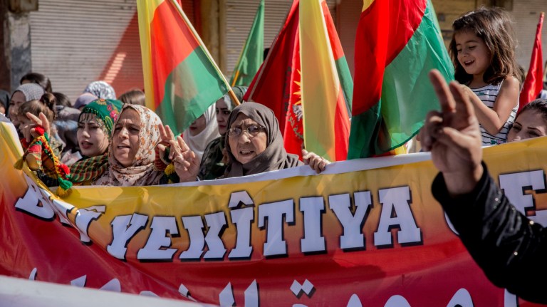Syrians march during a demonstration against possible Turkish military operation in their areas, in Al-Qahtaniya, Syria, Monday, Oct. 7, 2019. 