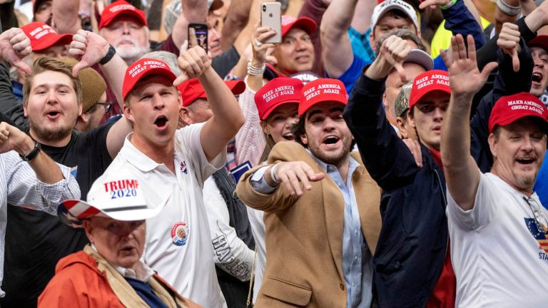 Supporters of President Trump heckle the media during a campaign rally, Thursday, Oct. 17, 2019, at the American Airlines Center in Dallas. 