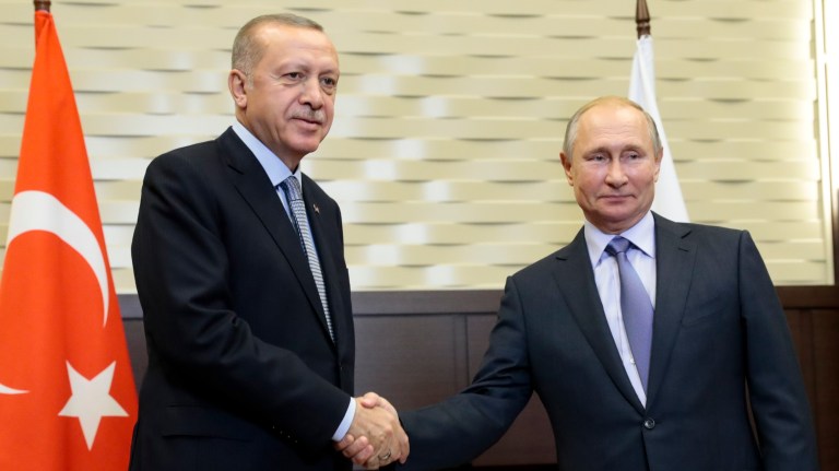 Russian President Vladimir Putin, right, and Turkish President Recep Tayyip Erdogan pose for a photo during their meeting in the Bocharov Ruchei residence in the Black Sea resort of Sochi, Russia, Tuesday, Oct. 22, 2019. 