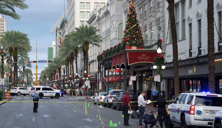 New Orleans police investigate the scene of a shooting Sunday, Dec. 1, 2019, on the edge of the city's famed French Quarter in New Orleans. 