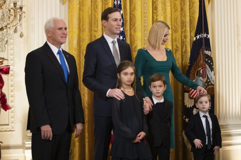 Vice President Mike Pence, from left, White House senior adviser Jared Kushner and his wife Ivanka Trump and their children, from front left, Arabella Kushner, Joseph Kushner and Theodore Kushner, attend a Hanukkah reception in the East Room of the White House Wednesday.