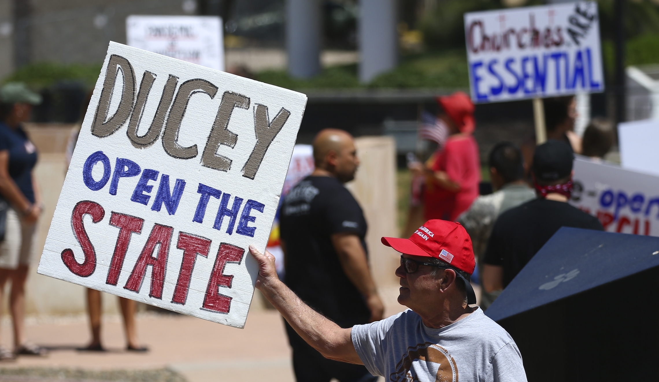 Hundreds gather around Arizona Capitol to protest shutdowns