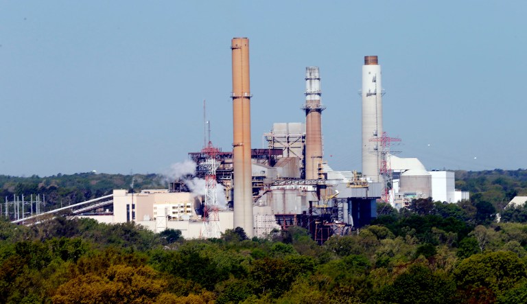 Dominion Power's coal fired power plant along the James River in Chester, Va., is shown.