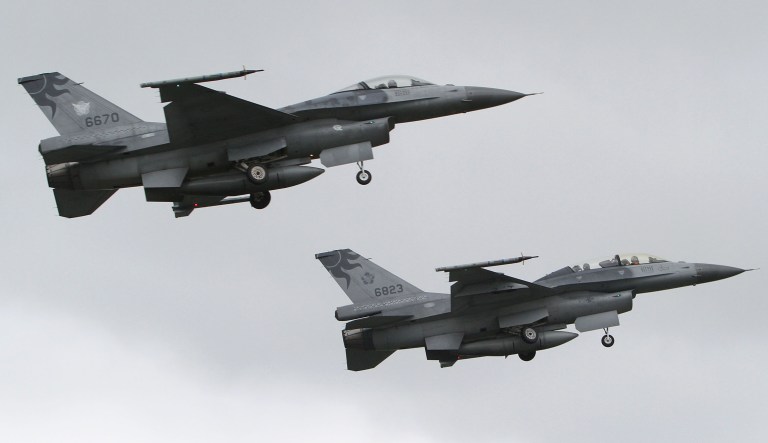 A formation of Taiwanese F-16 fighters fly by during a military exercise in Hualien, eastern of Taiwan, Wednesday, Jan. 23, 2013.