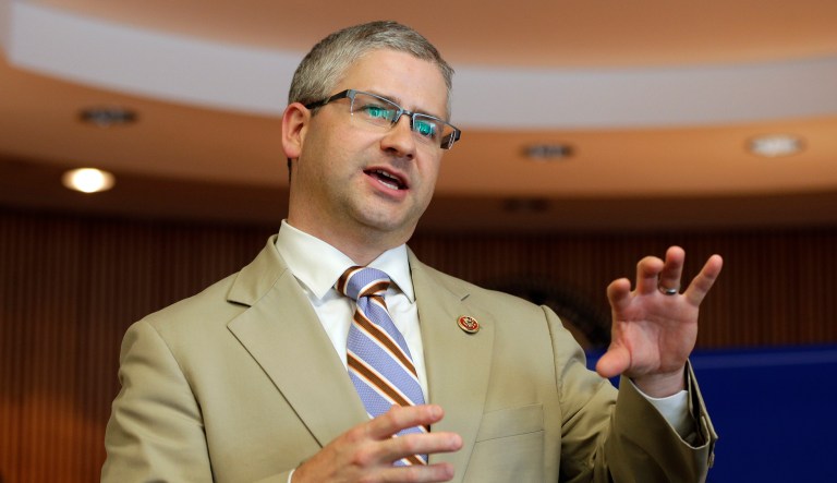 In this photo, taken Aug. 5, 2013, Rep. Patrick McHenry, R-N.C., speaks to a full house during a town hall meeting in Lincolnton, N.C.