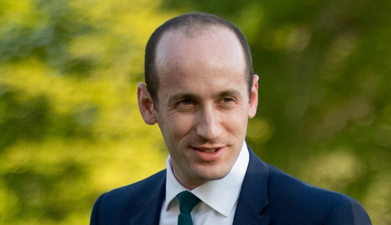 President Trump's White House senior adviser Stephen Miller walks across the South Lawn at the White House in Washington.