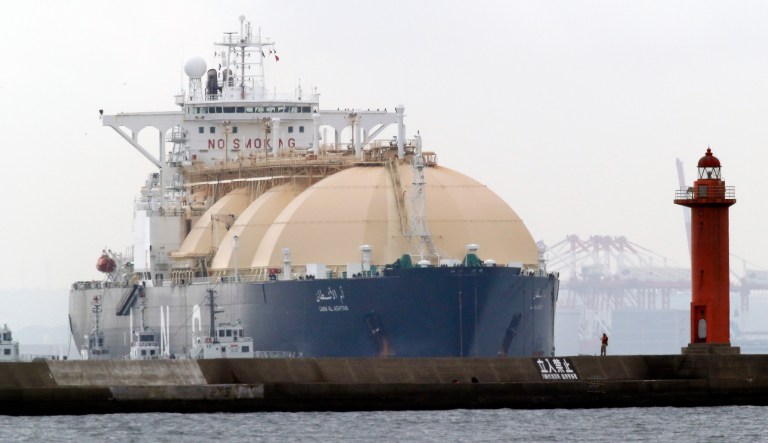 LNG tanker Umm Al Ashtan arrives at a port in Yokohama, southwest of Tokyo, Monday, Oct. 21, 2013. Japan's trade deficit ballooned to a fresh record for September as costs for imports of food and other necessities outstripped growth in exports. Imports of oil and gas accounted for nearly a third of the total but fell 1 percent as oil prices moderated.