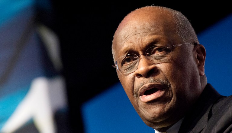 Herman Cain speaks at an event.