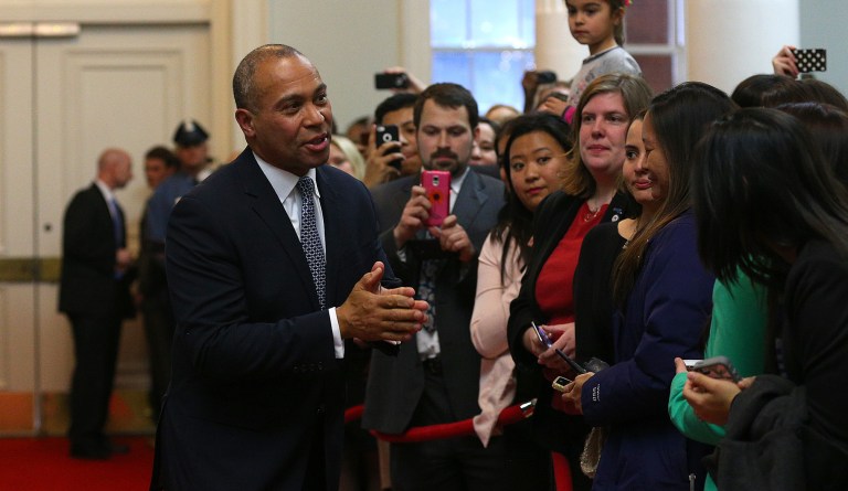 Gov. Deval Patrick greets former staffers as he makes the ceremonial "Last Walk" as he leaves the State House on his last day in office Wednesday, Jan. 7, 2015.