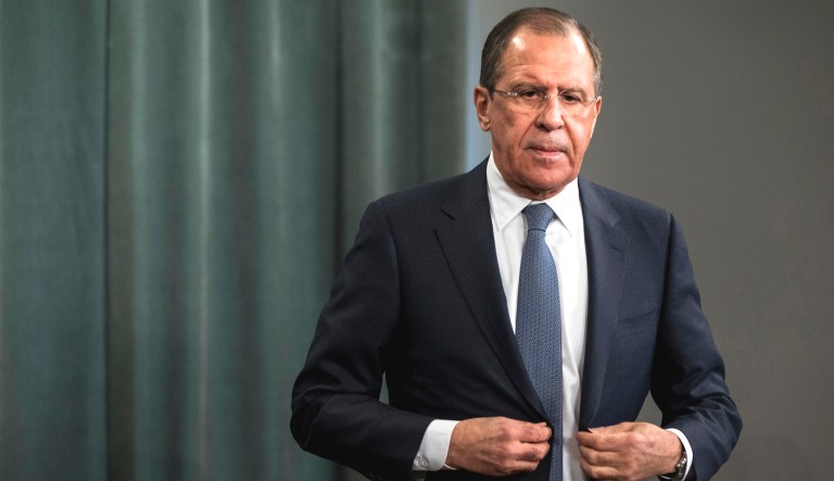 Russian Foreign Minister Sergey Lavrov attends a news conference.