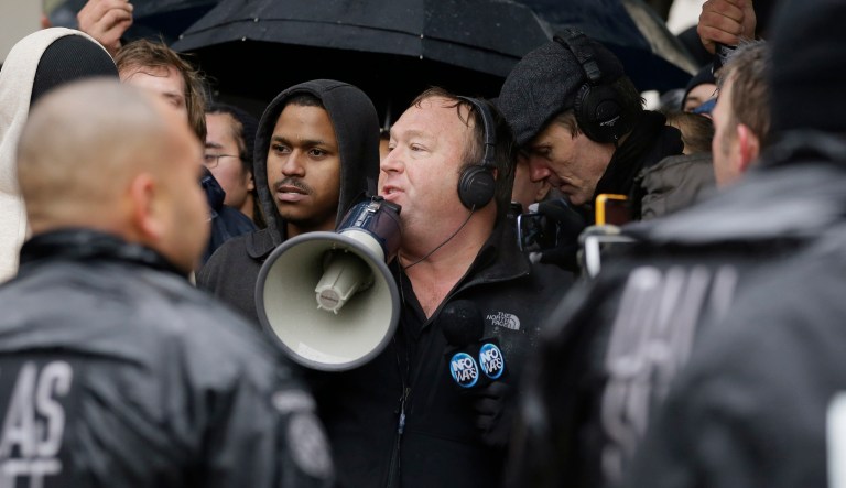 Talk show host Alex Jones leads a protest after a ceremony to mark the 50th anniversary of the assassination of John F. Kennedy, Friday, Nov. 22, 2013, at Dealey Plaza in Dallas. President Kennedy's motorcade was passing through Dealey Plaza when shots rang out on Nov. 22, 1963.