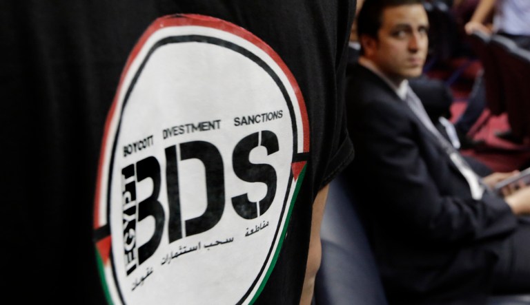 An Egyptian wears a T-shirt with the Boycott, Divestment and Sanctions (BDS) logo during the launch of the Egyptian campaign that urges boycott, divestment and sanctions against Israel and Israeli-made goods, at the Egyptian Journalistsâ Syndicate in Cairo, Egypt.