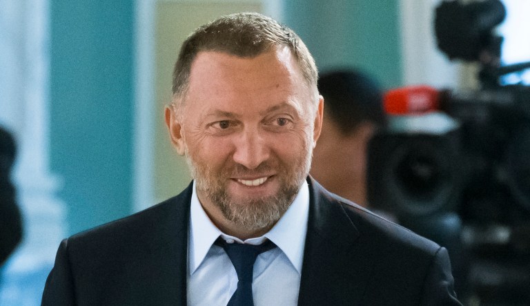 Russian metals magnate Oleg Deripaska attends a meeting of Russian President Vladimir Putin.  