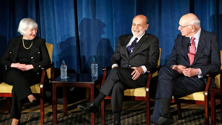 Federal Reserve chair Janet Yellen, left, and former Federal Reserve chairs Ben Bernanke, center, and Paul Volcker, right, react as they listen to former Fed Chair Alan Greenspan appearing via video conference, during a panel discussion.