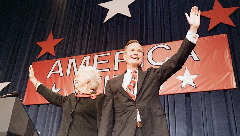 President-elect George H.W. Bush, right, and his wife Barbara, wave to the crowd at a victory celebration rally, Nov. 8, 1988.