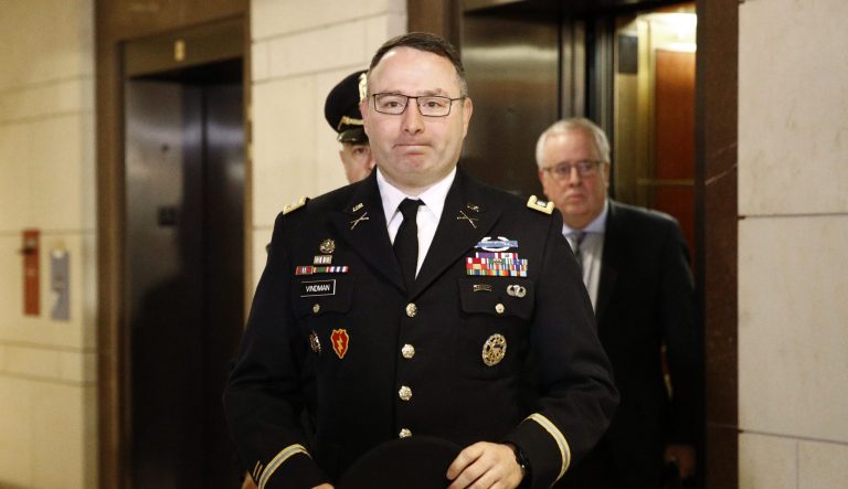 Army Lieutenant Colonel Alexander Vindman, a military officer at the National Security Council, center, arrives on Capitol Hill in Washington.