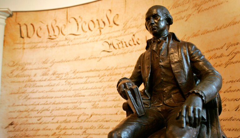 A statue of former President James Madison is shown in front of a mural of the Constitution in the education center at Montpelier, Madison's home, in Orange, Va., Wednesday, Aug. 13, 2008.