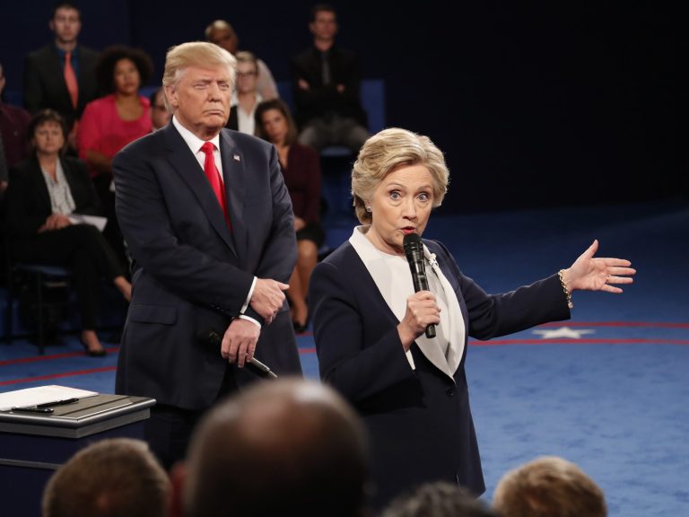 Hillary Clinton speaks as Donald Trump listens during their second presidential debate.