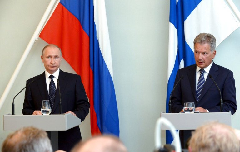 Russian President Vladimir Putin, left, reacts while Finnish President Sauli Niinisto speaks during their joint press conference in Savonlinna, Eastern Finland, on Thursday July 27, 2017. President Putin pays a working visit to Finland to discuss bilateral and international issues with his Finnish counterpart and to commemorate Finland's 100-year independence. 