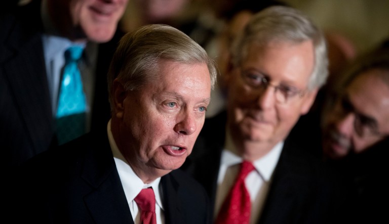 Sen. Lindsey Graham, R-S.C., flanked by Senate Majority Leader Mitch McConnell, R-Ky., right, speaks to reporters as they faced assured defeat on the Graham-Cassidy bill, the GOP's latest attempt to repeal the Obama health care law, at the Capitol in Washington, Tuesday, Sept. 26, 2017, in Washington.