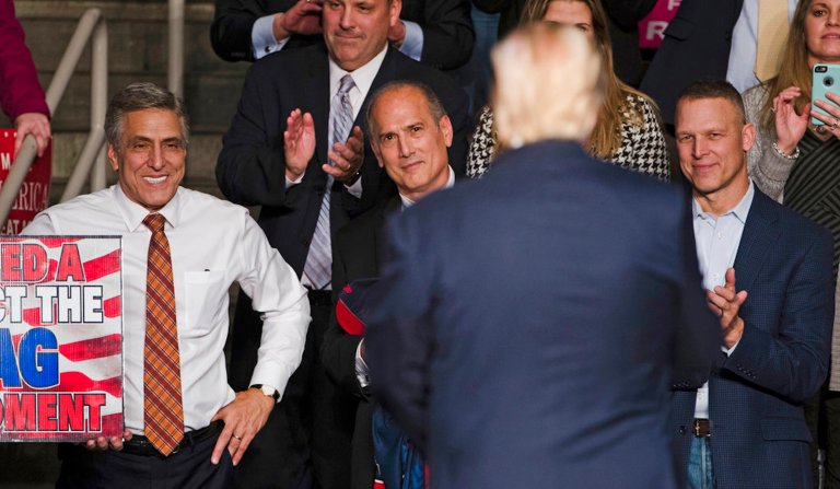 In this Dec. 15, 2016, file photo, U.S. Rep. Lou Barletta, R-Pa., left, U.S. Rep. Tom Marino, R-Pa., center left, and U.S. Rep. Scott Perry, R-Pa., right, watch as President-elect Donald Trump, center right, departs a rally in Hershey, Pa. 