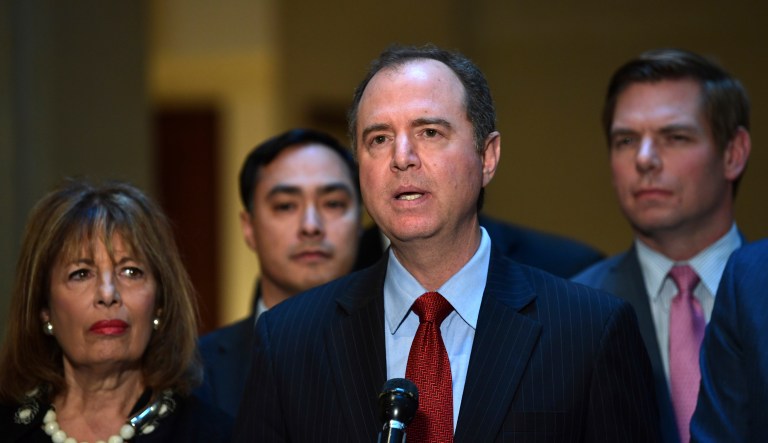 House Intelligence Committee Ranking Member Adam Schiff, D-Calif., surrounded by fellow Democrats, speaks to reporters on Capitol Hill on March 13, 2018.