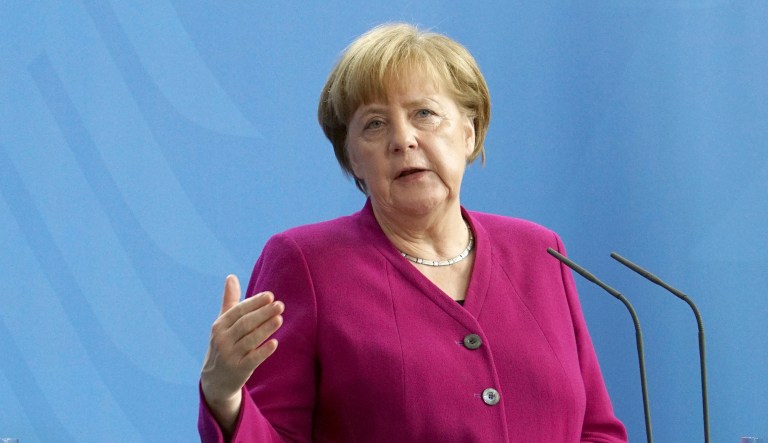 German Chancellor Angela Merkel addresses the media during a press conference. 