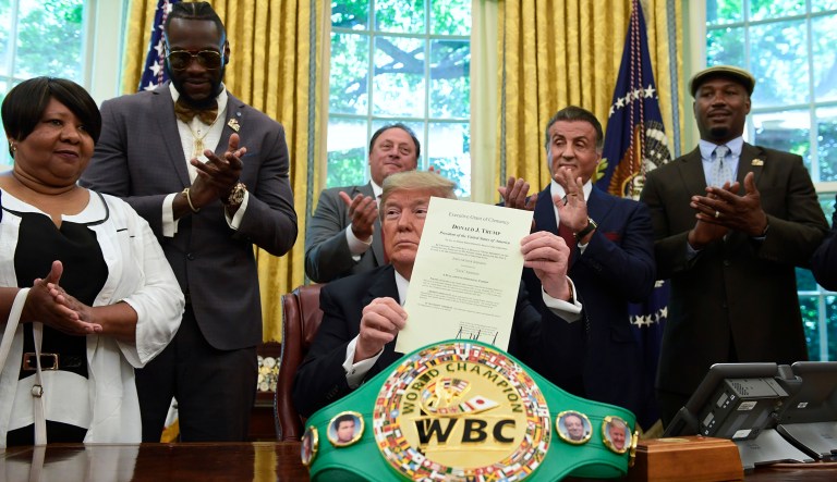 President Trump posthumous pardons Jack Johnson, boxing's first black heavyweight champion, during an event in the Oval Office. Trump is joined by Linda Haywood, who is Johnson's great-great niece, heavyweight champion Deontay Wilder,  Keith Frankel, Sylvester Stallone, and former heavyweight champion Lennox Lewis. 