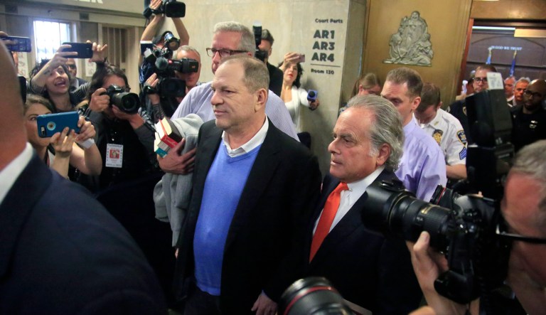 Harvey Weinstein leaves with his lawyer Benjamin Brafman, right, after posting bail at Manhattan's Criminal Court in New York. Weinstein was arraigned Friday on rape and other charges in the first criminal prosecution to result from the wave of allegations against him that sparked a national reckoning over sexual misconduct.  