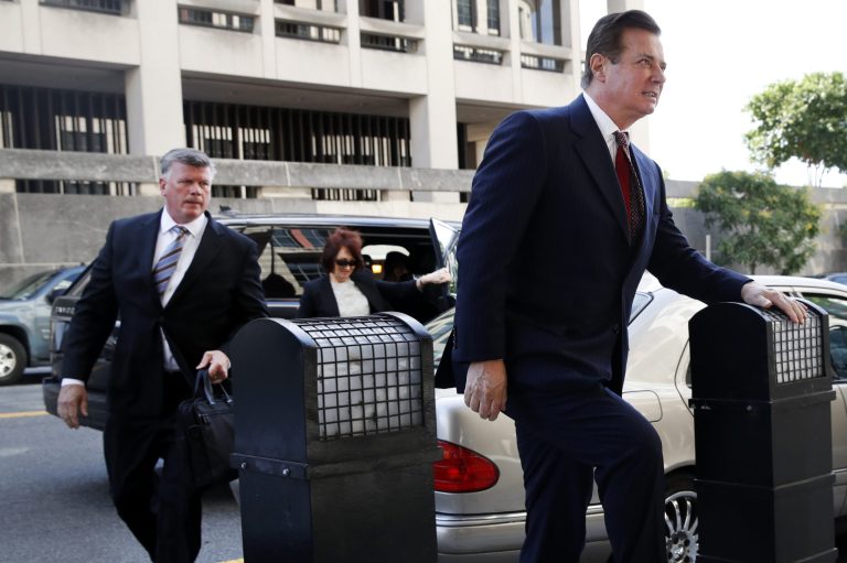 Paul Manafort, right, arrives at federal court accompanied by his lawyer Kevin Downing, left, and wife Kathleen Manafort, Friday, June 15, 2018, in Washington.