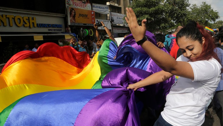 Gay rights activists celebrate after the country's top court struck down a colonial-era law that made homosexual acts punishable by up to 10 years in prison.