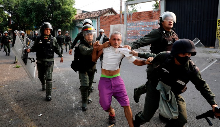 A man is detained during clashes with the Bolivarian National Guard in Urena, Venezuela, near the border with Colombia.
