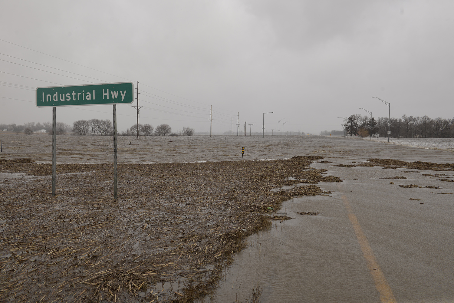 Highway 81 near the Industrial Highway intersection north of Norfolk, Neb., is covered for a long stretch with strong flowing flood waters. Thousands of people have been urged to evacuate along eastern Nebraska rivers as a massive late-winter storm has pushed streams and rivers out of their banks throughout the Midwest.