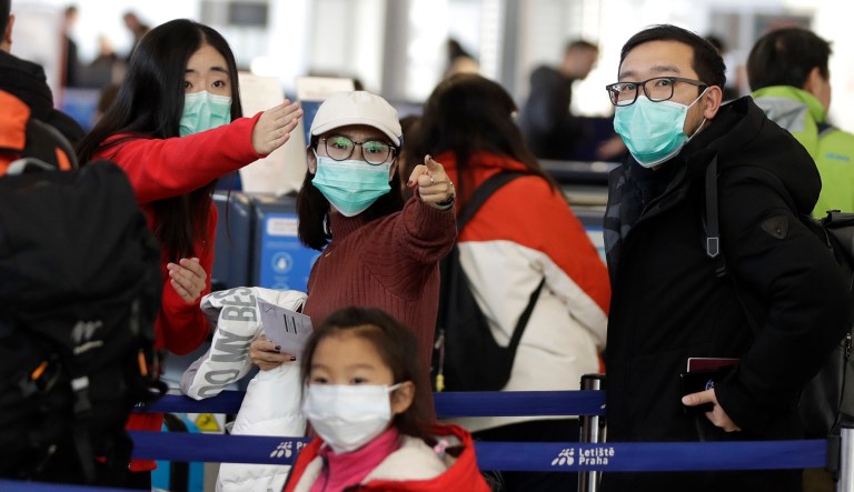 As coronavirus spreads, Trump’s travel ban may be helpful