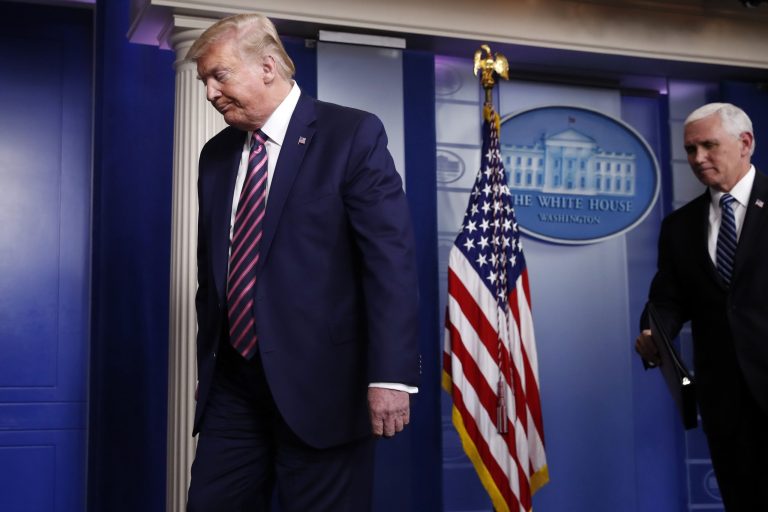 President Donald Trump and Vice President Mike Pence leave at the end of a briefing about the coronavirus in the James Brady Press Briefing Room of the White House Friday.