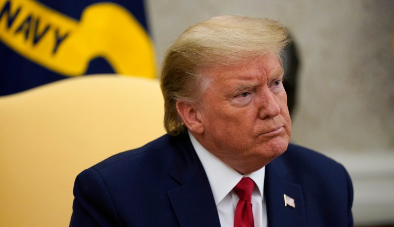 FILE - In this May 7, 2020, file photo President Donald Trump listens during a meeting about the coronavirus response in the Oval Office of the White House in Washington. Trump is hoping to persuade a Supreme Court with two of his appointees to keep his tax and other financial records from being turned over to lawmakers and a New York district attorney. The justices are hearing arguments by telephone Tuesday, May 12.