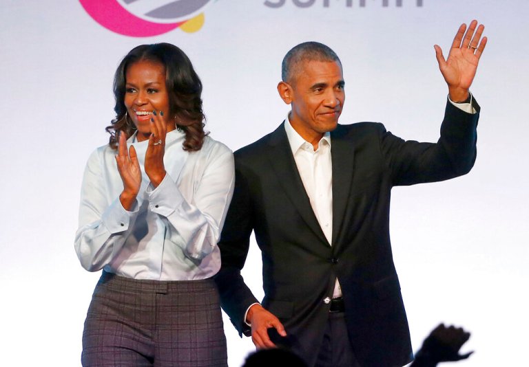 FILE - In this Oct. 31, 2017, file photo, former President Barack Obama, right, and former first lady Michelle Obama appear at the Obama Foundation Summit in Chicago.