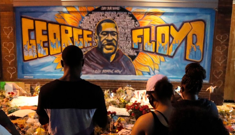 A picture of George Floyd is seen amid protests across the United States over his death after an officer knelt on Floyd's neck for several minutes.