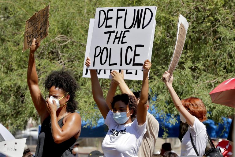 Protesters rally Wednesday, June 3, 2020, in Phoenix, demanding the Phoenix City Council defund the Phoenix Police Department. A new pro-police super PAC has formed to challenge "defund" efforts nationally.
