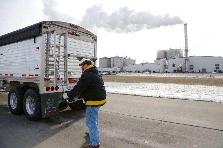 In this photo from Jan. 6, 2015, a grain truck operator prepares his cargo of corn for delivery to the Green Plains ethanol plant in Shenandoah, Iowa.