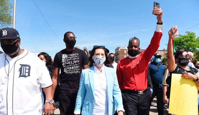 Gretchen Whitmer criticized for marching shoulder to shoulder with protesters after months of social distancing orders